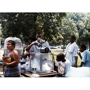 Teenagers operating a cotton candy making machine at Festival Betances 1999.