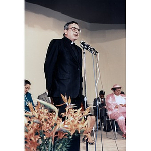 Priest speaking at the opening of the Villa Victoria Cultural Center.