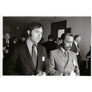 Two men standing side by side during a Boys' Club meeting