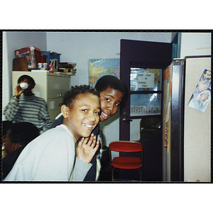 Two youth stand in the Science/Nature room at a Tri-Club event