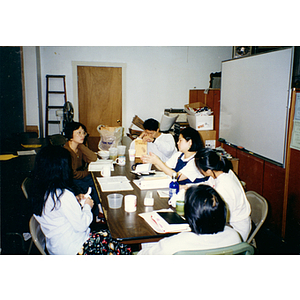 Chinese Progressive Association employees at a meeting