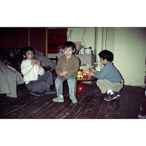 Children playing at a meeting between Mexican workers and the Chinese Progressive Association