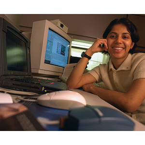 Co-op student surrounded by computers