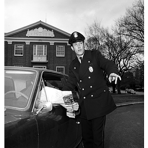 A Criminal Justice student aids a motorist while on co-op with the Lexington Police Department