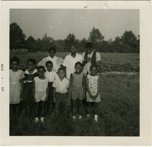 Freedom School students gathered by cotton field outside the school