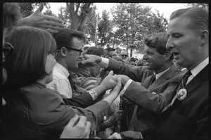 Robert F. Kennedy shaking hands with the crowd after stumping for Democratic candidates