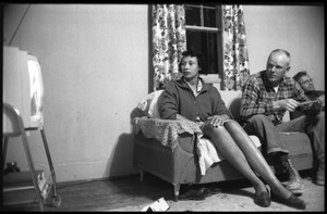 Mildred and Richard Loving (from left) seated on a couch with Richard's father, watching television