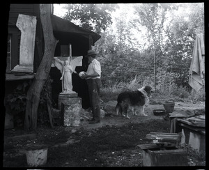 Carlo Abate, with pet dog outside his studio