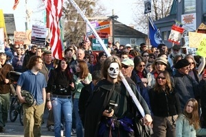 Anti-war marchers, one wearing a skull mask: rally and march against the Iraq War
