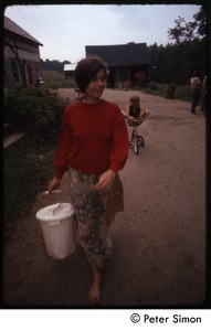 Woman with a bucket, Tree Frog Farm commune