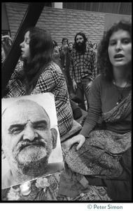 Cathy Brown (Usha, right) with portrait of Neem Karoli Baba during an appearance at the College of Marin