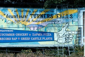 Billboard advertising various Renaissance Community businesses in Turners Falls