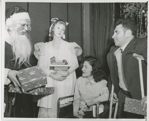 Santa Claus handing gifts to clients