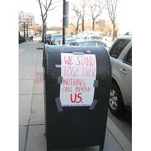 "We Stand Together" sign on mailbox