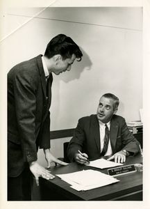 Suffolk University Dean of Students D. Bradley Sullivan, seated, with student