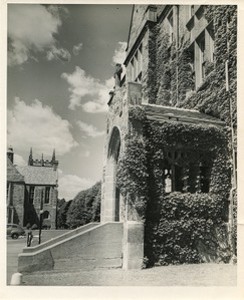 Gasson Hall exterior: entrance way and ivy with view of Bapst Library Ford Tower in background