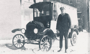 Ambrose Stevens and his 1921 Ford Model T mailtruck with skis
