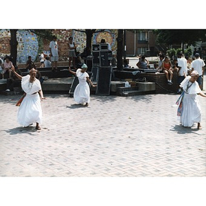 Three women performing a folk dance in the plaza at Festival Betances.