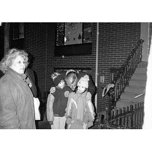 Mayor Menino with two children during a Villa Victoria community Christmas celebration.