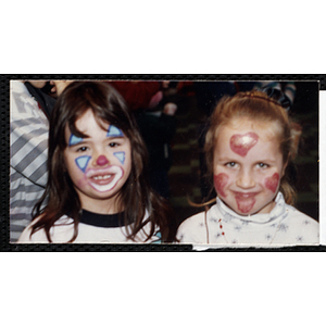 Two girls with painted faces posing at a joint Charlestown Boys and Girls Club and Charlestown Against Drugs (CHAD) event