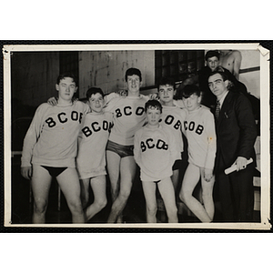 Members of the Boys Club of Boston's swim team pose for a candid shot with their coach Bill Shinney