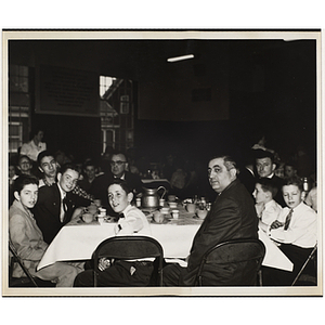 Boys' Club members seated around a table at an awards event