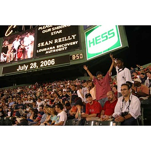 Torch Scholars cheer in their seats at Fenway Park