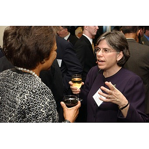 Two women converse at The National Council Dinner