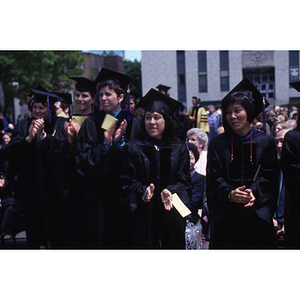 Students clapping at the School of Law Commencement