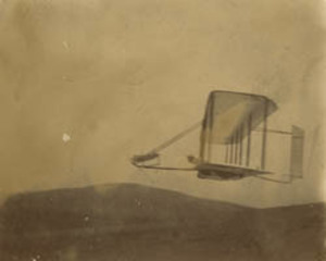 Side view of the Wright 1903 glider in flight at Outer Banks, North Carolina