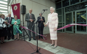 Dedication ceremonies for the Conte Polymer Center: Corinne Conte cutting the ribbon