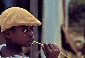 Barbados boy with a cap and straw