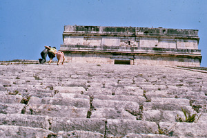 Three people climbing a pyramid