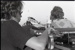 Hollywood Speedway Rock Festival: Jo Baker with Elvin Bishop Group in concert, pouring alcohol into Coke can