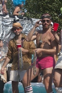 Parade marchers with strings of beads : Provincetown Carnival parade