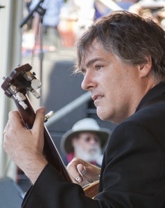 Bela Fleck with his banjo, on stage at the Clearwater Festival