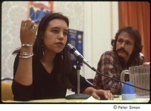 MUSE concert and rally: Winona LaDuke answering a question at a press conference while Jesse Colin Young looks on