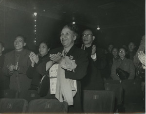 Shirley Graham Du Bois applauding in an audience