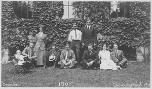 Members of the class of 1905 and others standing and sitting in front of Old Chapel