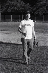 Boston Phoenix vs. WBCN staff softball game: Harper Barnes holding a beer