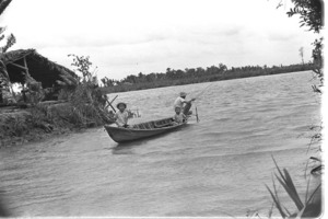 Children fishing on Vai Co River because adults are shot at by Vietcong on opposite bank; Luong Hoa Village.