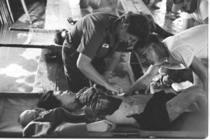 U.S. medics attending to Vietnamese wounded; Loc Trang.