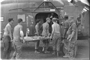 Wounded Marines loaded aboard chopper, Donh Ha.