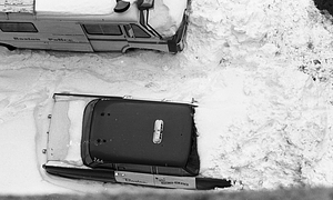 Boston Police vehicles buried in snow