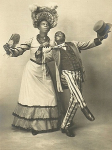 Jack Brown Poses in Drag alongside Dance Partner Charles Gregory with Arm Outstretched