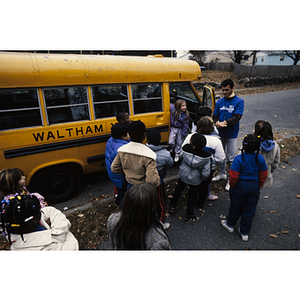 Children boarding a Waltham school bus