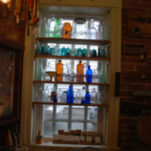 Window sill full of bottles