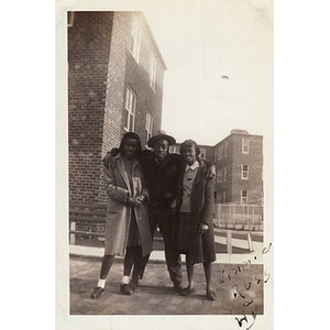 "Winnie" Irish poses with Russell and Hyacinth in front of the Lenox Street Projects