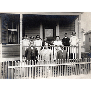 Family portrait, eleven pose on front porch