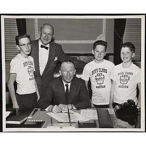 Lt. Govenor Robert F. Murphy (seated) proclaims Boys' Club Week as Executive Director of Boys' Clubs of Boston Arthur T. Burger pose with (left to right) Charles O'Keefe, Walter Jenkins, and Michael Walsh